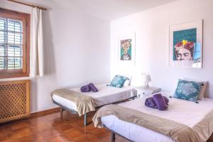 Postel nebo postele na pokoji v ubytování Casa Mamita Ibiza