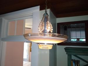 a chandelier hanging from a ceiling in a kitchen at Surf Song Bed & Breakfast in Tybee Island