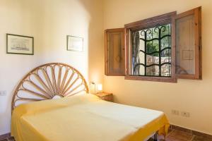 Letto o letti in una camera di San Teodoro Villa Nina Costa Caddu