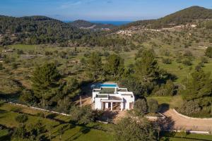 an aerial view of a white house with a swimming pool at Can Ramon 1 in Sant Josep de Sa Talaia