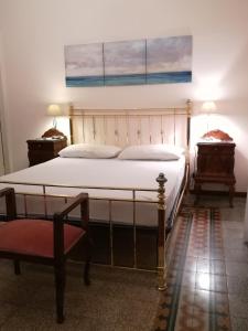 מיטה או מיטות בחדר ב-Casa Gabriella
