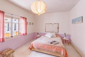 Postel nebo postele na pokoji v ubytování Casa De La Mar 19