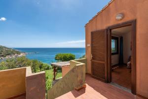 a house with a view of the ocean at Accu is Prezzus tipo H fronte mare in Villasimius
