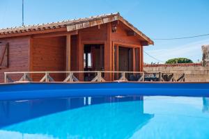 a house with a pool in front of it at Las tres hermanas in Conil de la Frontera