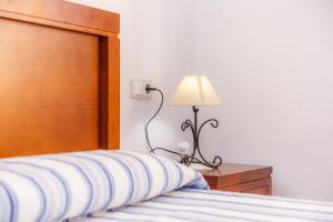Postel nebo postele na pokoji v ubytování Villa Jacoba