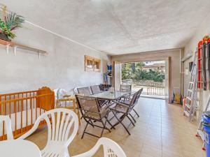 a dining room with a table and chairs at Villa Manresa in Alcudia