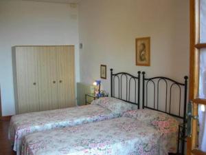 Katil atau katil-katil dalam bilik di Capoliveri: Villa Lorena 1 (bilocale) +13 gambar