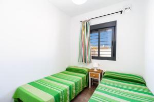 Posteľ alebo postele v izbe v ubytovaní Villa Los Olivares