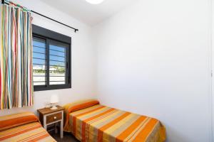 Posteľ alebo postele v izbe v ubytovaní Villa Los Olivares