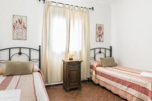 Posteľ alebo postele v izbe v ubytovaní Casa Familiar La Lobita 1 + 17 fotografií