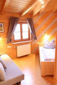 a room with two beds in a log cabin at Haus Pöckl in Strobl