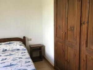 Voodi või voodid majutusasutuse Il Boschetto dei Corbezzoli Villetta 1h toas