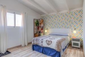 Posteľ alebo postele v izbe v ubytovaní Atico Casapueblo