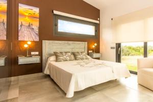 Ein Bett oder Betten in einem Zimmer der Unterkunft Villa Ca Na Marga