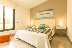 Ein Bett oder Betten in einem Zimmer der Unterkunft Villa Ca Na Marga