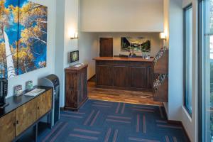 a living room filled with furniture and a tv at Tamarack Lodge in Ketchum