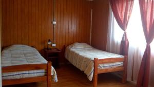
Cama o camas de una habitación en Hostal Loa
