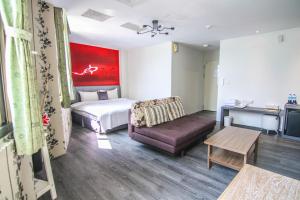Ένα ή περισσότερα κρεβάτια σε δωμάτιο στο Sun Moon Lake Loft Inn