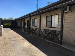 a row of mobile homes parked next to a building at Pit Pony Hotel in Collinsville