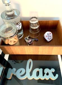 a wooden box with a table with a sign that says rave at Cute Pug Guest Room in Copenhagen