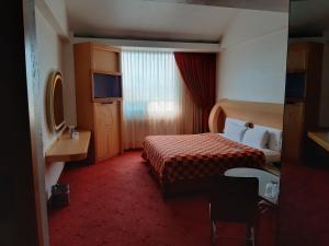 Postel nebo postele na pokoji v ubytování AUTO HOTEL LEGARIA