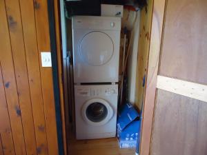a washer and dryer in a tiny house at 5 Dune Park in Keurboomstrand