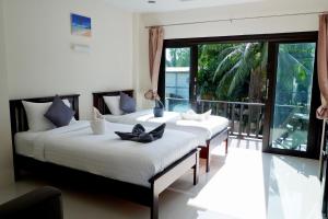 Postel nebo postele na pokoji v ubytování Aiya Resort Koh-Tao