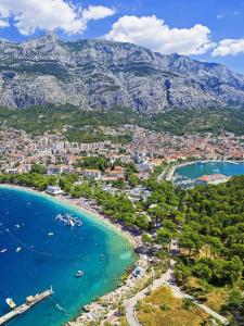 an aerial view of a beach with boats in the water at Luxury apartment Macola Free beach parking in Makarska
