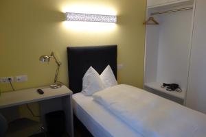 Postel nebo postele na pokoji v ubytování Partner Hotel AG Zofingen