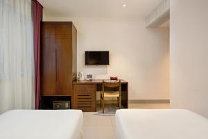 Giường trong phòng chung tại Sen Boutique Hotel