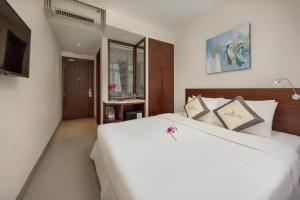 Giường trong phòng chung tại Sen Boutique Hotel