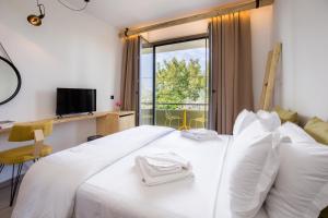 Postel nebo postele na pokoji v ubytování Filippos Hotel