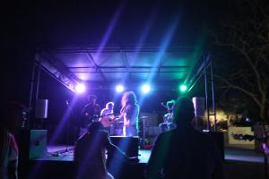 a group of people on a stage at night at Manulalu B&B in Bajawa
