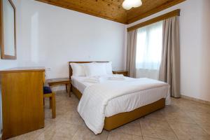 Postel nebo postele na pokoji v ubytování Filippos Hotel