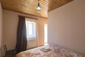 Katil atau katil-katil dalam bilik di Guesthouse and Cottage Nicolo