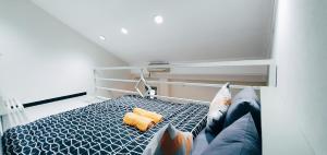 Postel nebo postele na pokoji v ubytování MADOR Malang Dorm Hostel