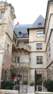 a building with a gate in front of it at Hotel D'haussonville in Nancy