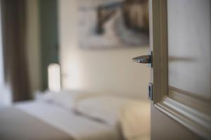 Posteľ alebo postele v izbe v ubytovaní Cefalù Design Suites
