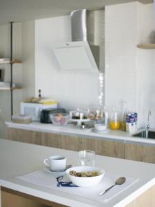 Kuchyň nebo kuchyňský kout v ubytování Sosiego Hostal de Mar