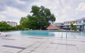 a large swimming pool in a apartment complex at Sweet Sweet Zenith Johor Bahru in Johor Bahru