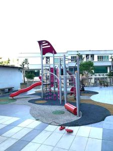 a playground with a slide in a park at Sweet Sweet Zenith Johor Bahru in Johor Bahru