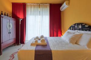 a bedroom with a bed with a tray of towels on it at La Terrazza in Arezzo