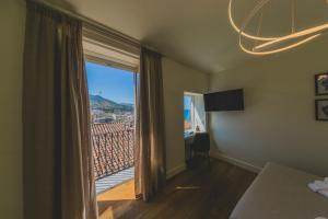 Posteľ alebo postele v izbe v ubytovaní Cefalù Design Suites