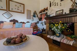 a living room with a table and a couch at Traditional Family Cretan Home! in Yerakianá