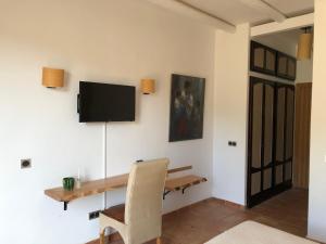 Telewizja i/lub zestaw kina domowego w obiekcie Cortijo El Paraíso