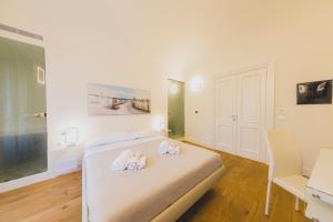 Posteľ alebo postele v izbe v ubytovaní Cefalù Design Suites