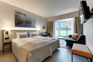 Postel nebo postele na pokoji v ubytování Tyrifjord Hotell