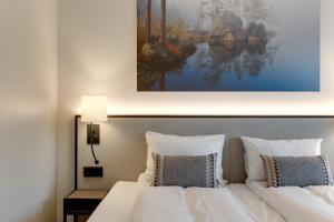 Postel nebo postele na pokoji v ubytování Tyrifjord Hotell