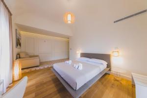 Posteľ alebo postele v izbe v ubytovaní Cefalù Design Suites