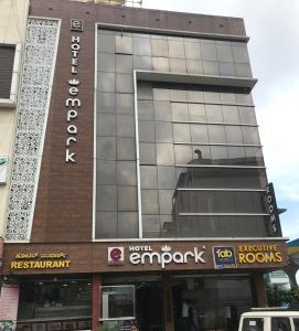 a building with a sign on the front of it at Empark in Bengaluru
